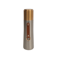 Insulated water bottle with gold lid and side leather carry loop