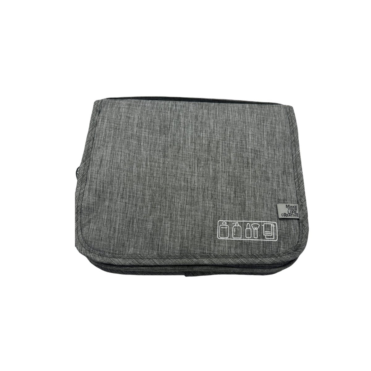 Grey travel bag with foldover flap and small front patch with icons