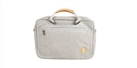 Light gray laptop bag back view with top handle and front pocket panel
