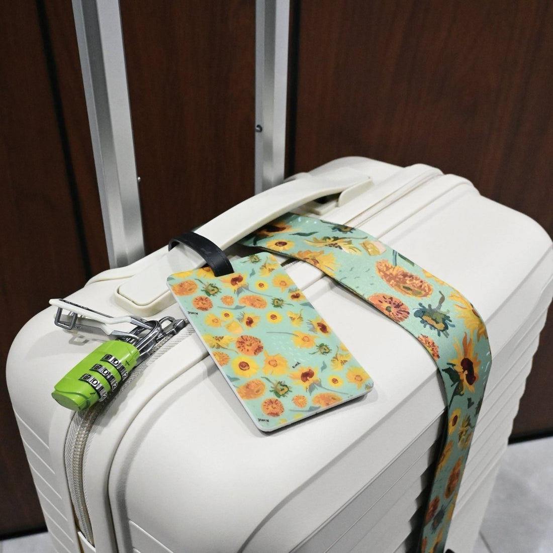 Luggage strap set with floral luggage strap and matching luggage tag on white suitcase