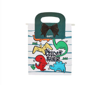 White gift bag with dinosaur trio illustration and dark green bow handle