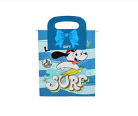 Blue gift bag with cartoon surfer character and bow-shaped handle