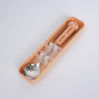 Orange storage case with animal-themed spoon and chopsticks set