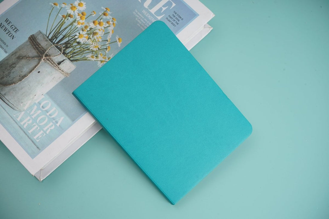Teal simple notebook with smooth cover and rounded corners