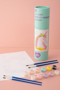 Unicorn paint-by-numbers art set with brushes, paint pots, and unpainted sheet