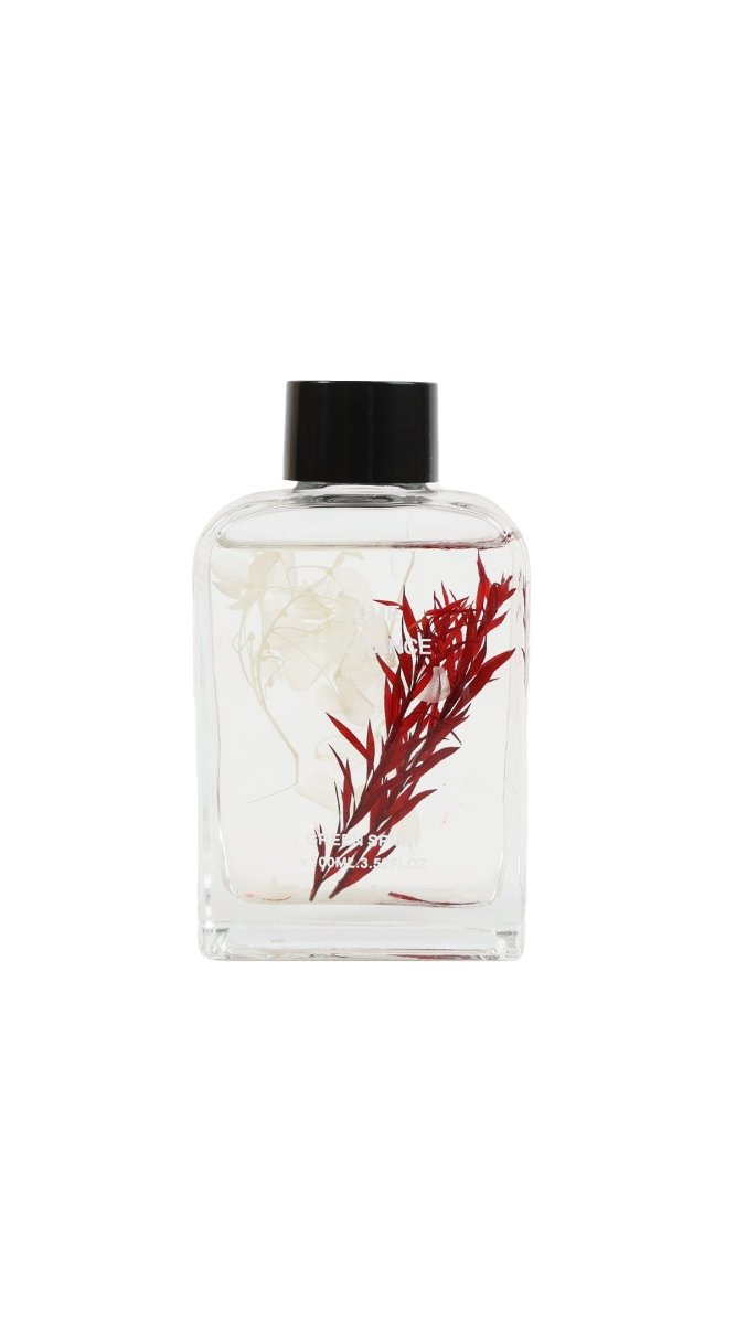 Reed diffuser refill bottle with black cap, clear glass and red botanical illustration