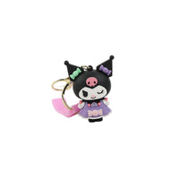 Cartoon character keychain with black cat character in lilac outfit, pink strap, gold key ring