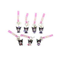Set of cartoon character keychains with black figures and pink floral straps, gold rings