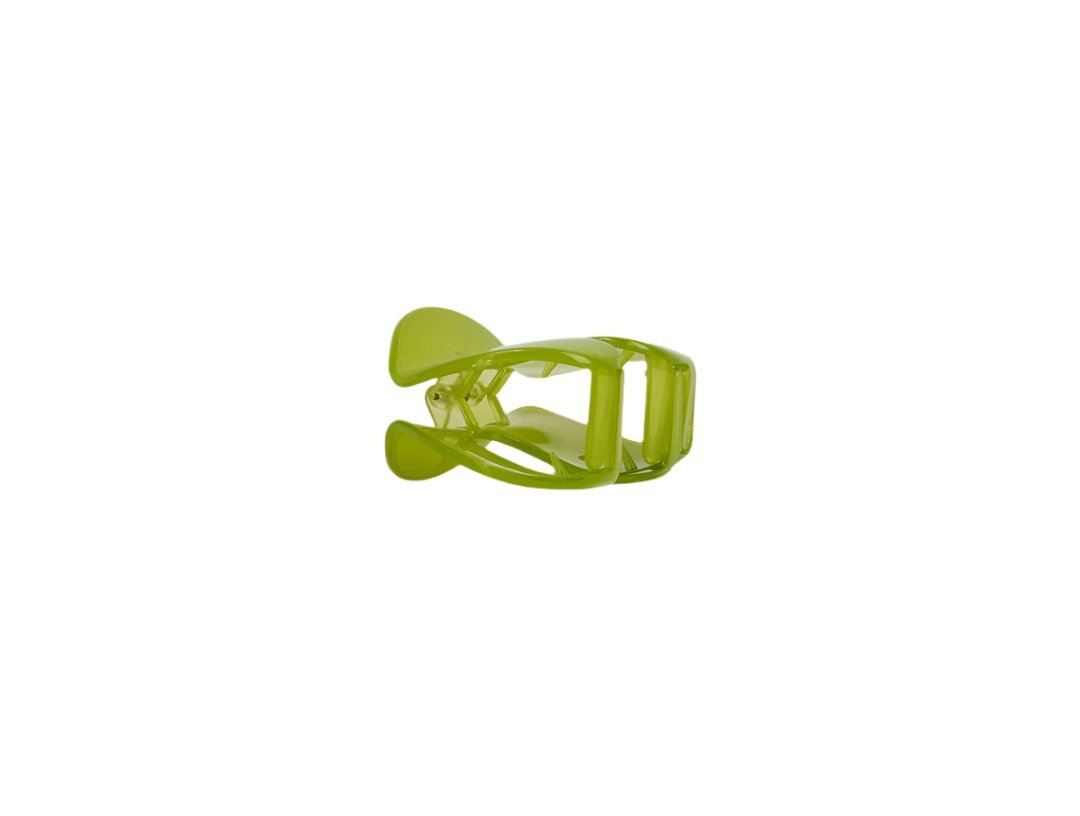 Green plastic hair clip, angled view with open prongs