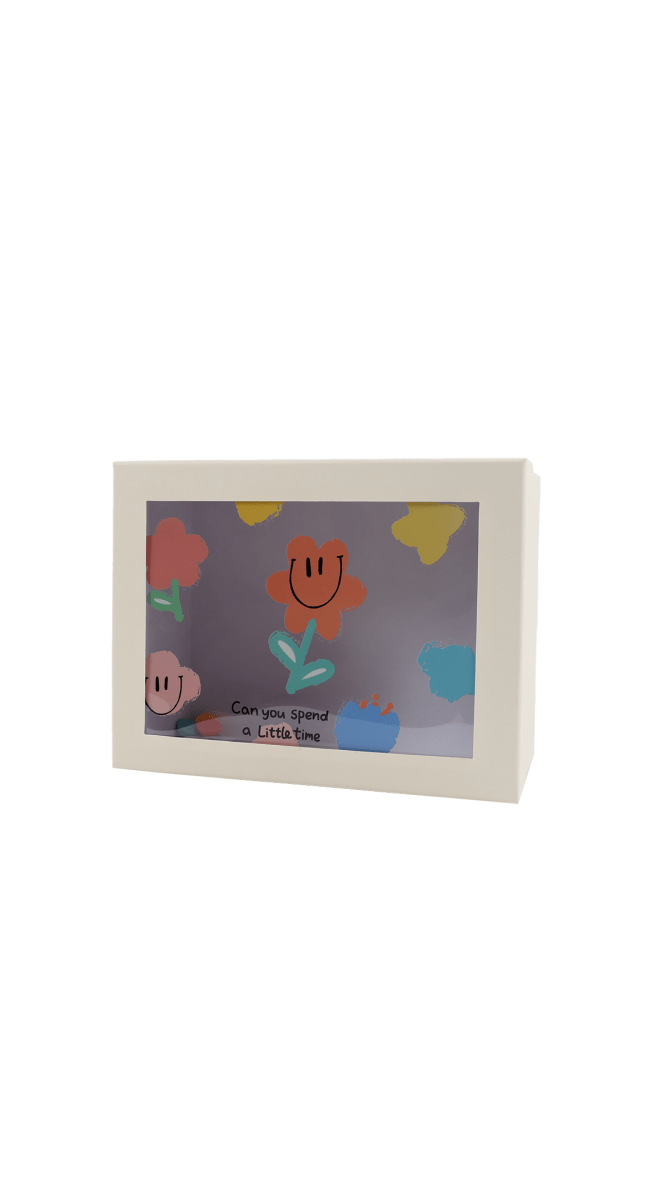 Gift box front angled, featuring cartoon animal characters and illustrated landscape