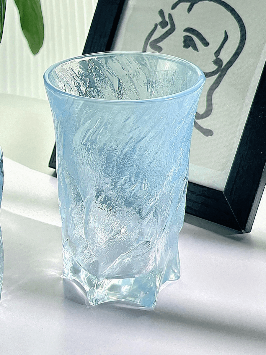 Blue 300ml glass cup with textured clear finish, cylindrical shape