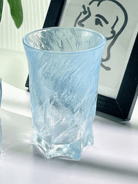 Blue 300ml glass cup with textured clear finish, cylindrical shape