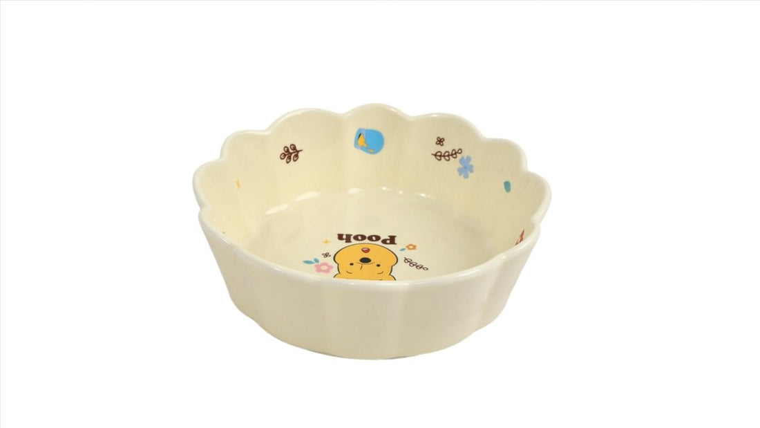 Winnie the Pooh ceramic bowl with scalloped rim and Pooh graphic near center