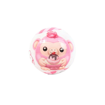 Snackles capsule toy ball with smiling bear figure and pink face, pink and white